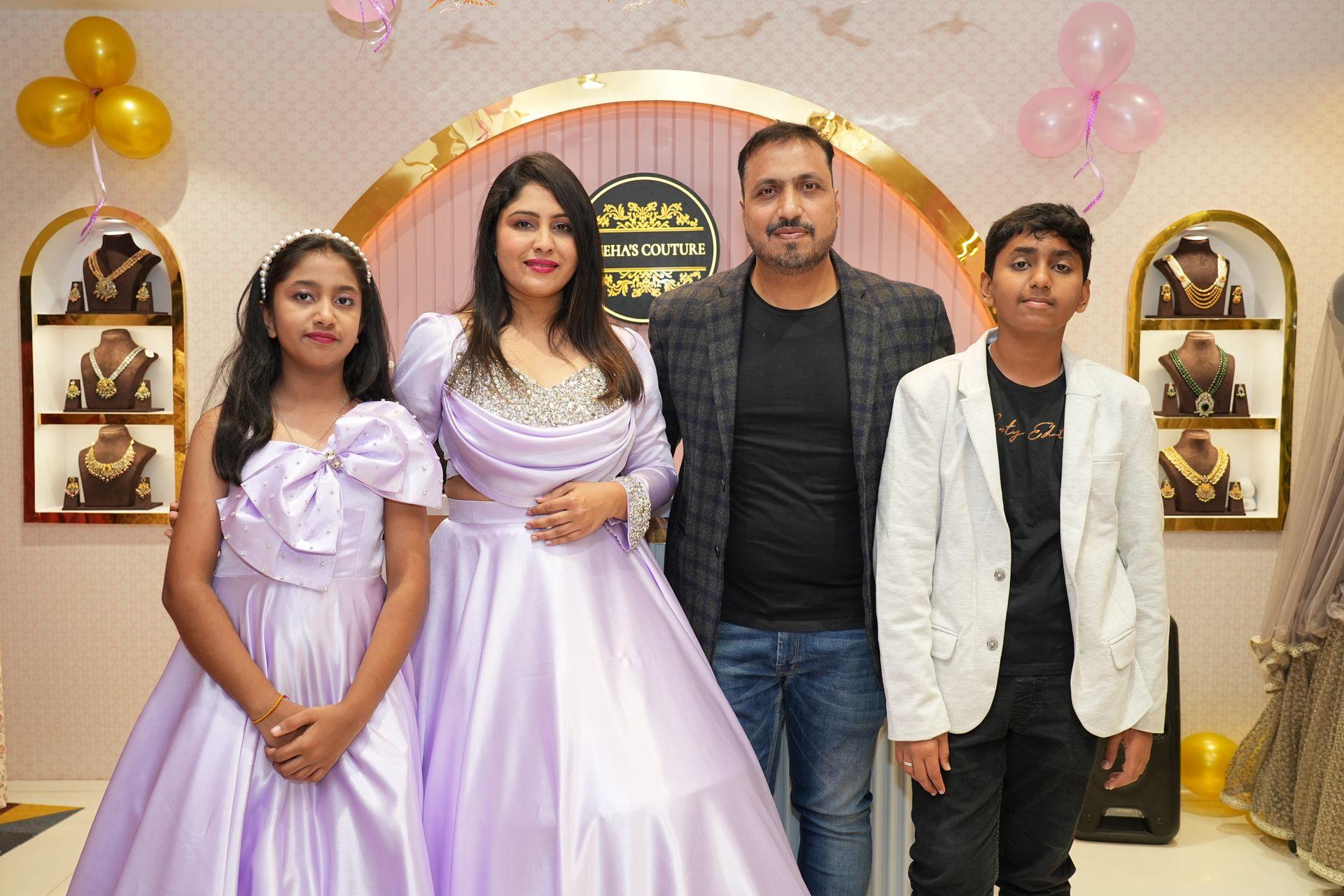 Sneha’s Couture boutique with family